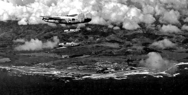 B-24 Escorting 2 Culver PQ-14s, with Kahuku runways below