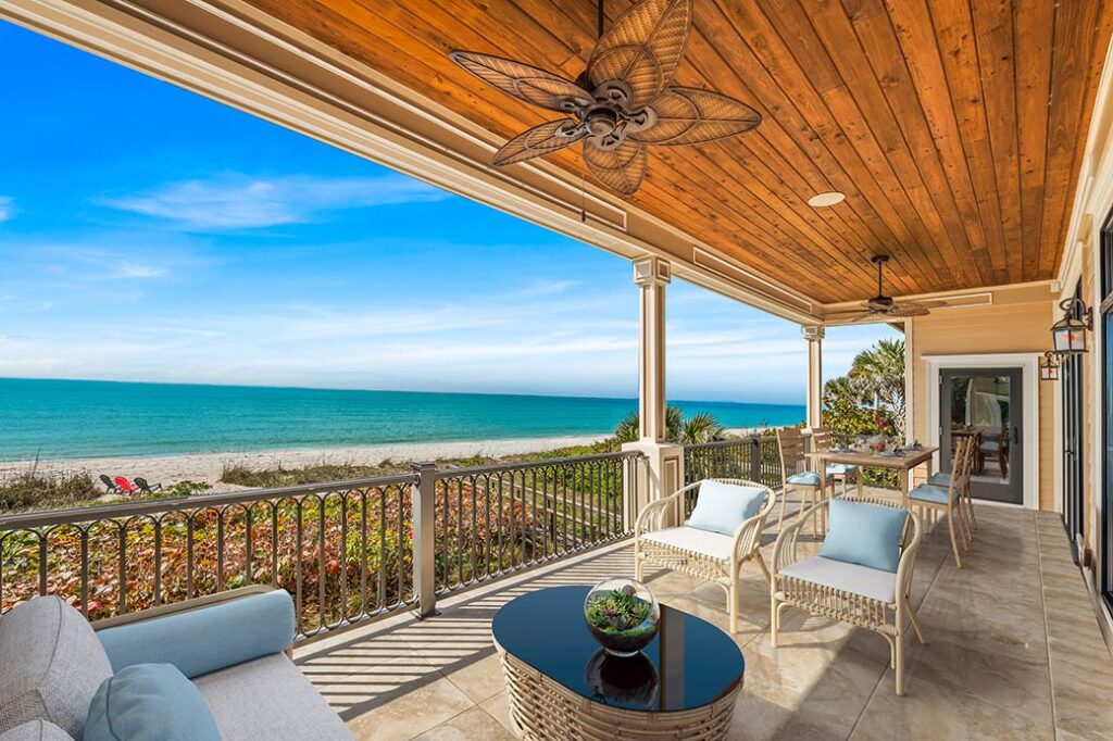 Full-length veranda spans beach at Casey Key